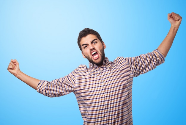 Arab man expressing anger on blue background. 