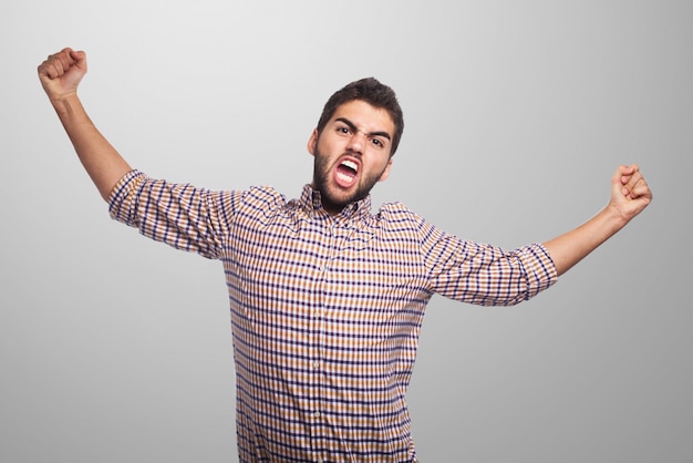 Arab man posing on gray background. 