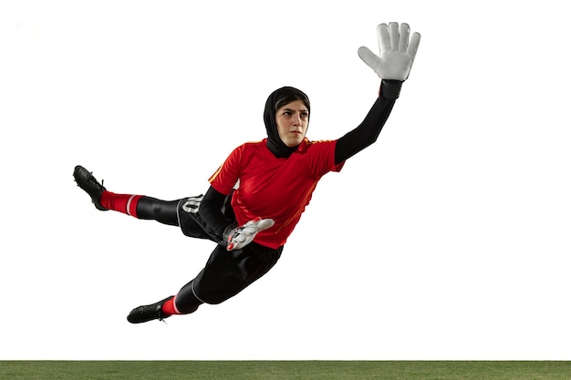 Free photo arabian female soccer or football player, goalkeeper on white studio background.