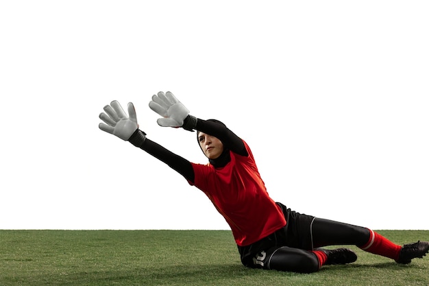 Free photo arabian female soccer or football player, goalkeeper on white studio background.