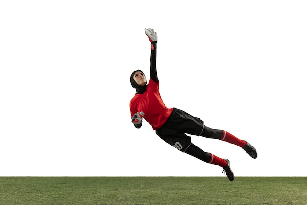 Free photo arabian female soccer or football player, goalkeeper on white studio background.