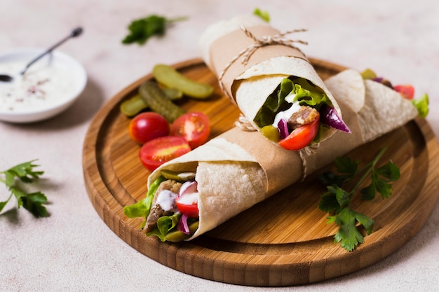 Arabic kebab sandwich on wooden board high view