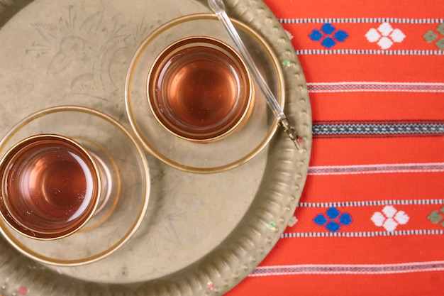 Free photo arabic tea in glasses on tray