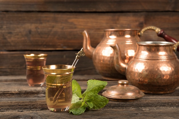 Arabic tea in glasses with teapots