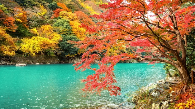 Arashiyama in autumn season along the river in Kyoto, Japan.