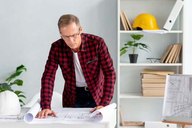 Free photo architect putting his project on paper