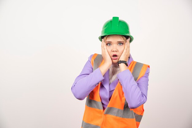 architect woman in helmet on white.