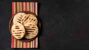 Free photo arepas on plate with copy-space