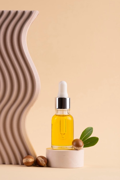 Free photo argan oil in dropper bottle arrangement