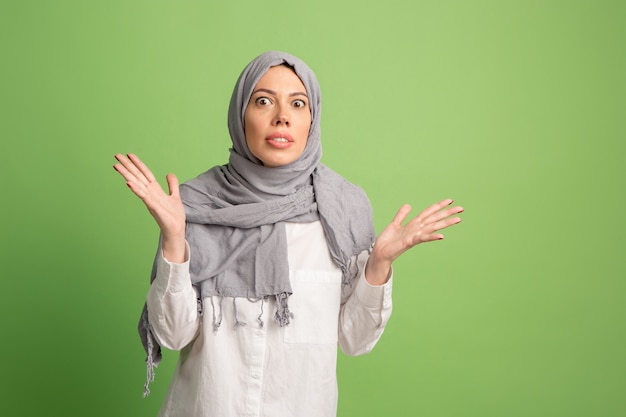 Argue, arguing concept. arab woman in hijab. Portrait of girl, posing at studio background