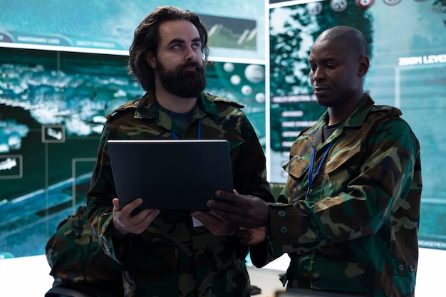 Free photo army it engineering team collects tactical data with surveillance radar system