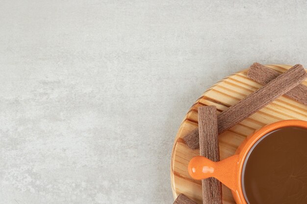 Aroma coffee and cocoa biscuits on wooden plate