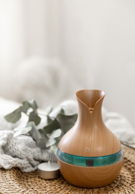 Free photo aroma oil diffuser lamp on a blurred background