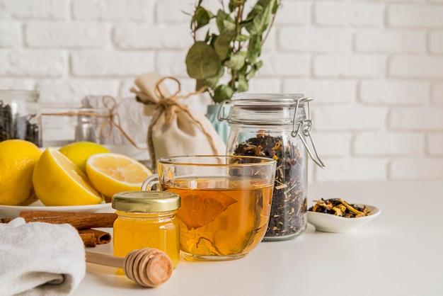 Aromatic tea with lemon on desk