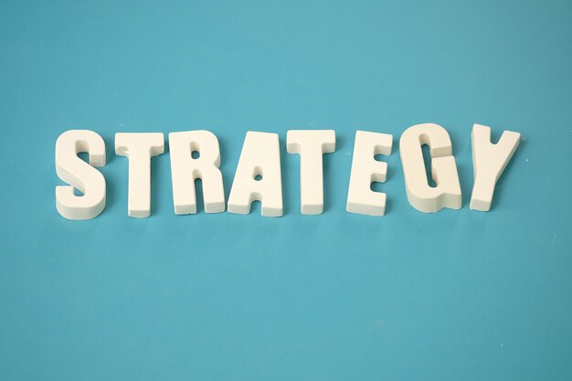 arrange white letters STRATEGY