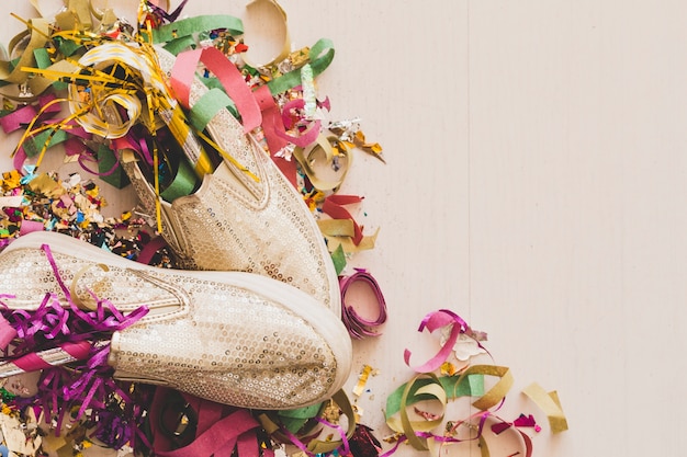 Free Photo arranged stylish shoes and confetti