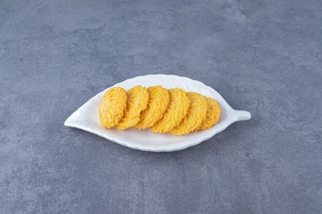 Arrangement biscuit on a plate on marble table.