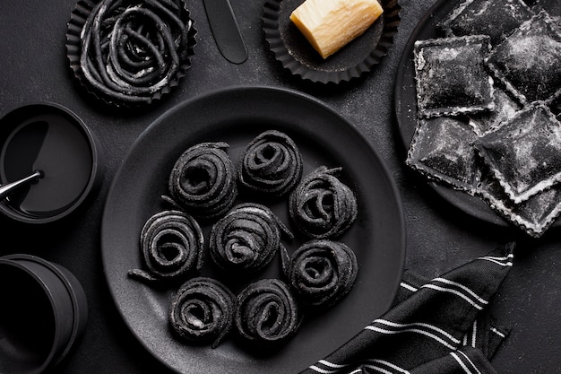 Free photo arrangement of black delicious foods on dark table