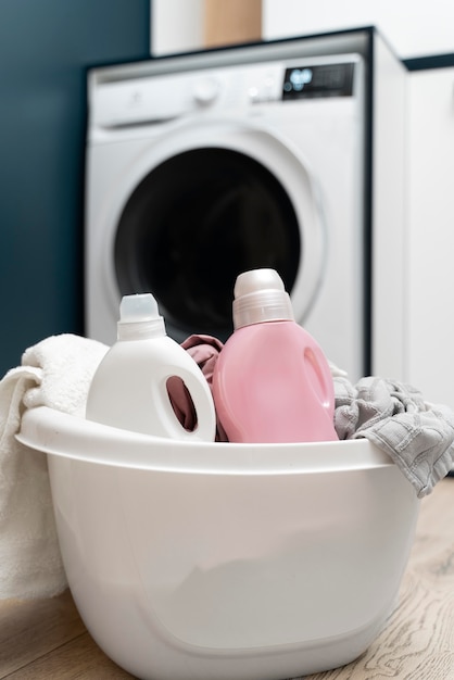 Free Photo arrangement of clothes in a basket in the washing room