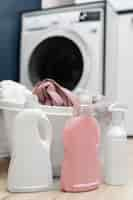 Free photo arrangement of clothes in a basket in the washing room