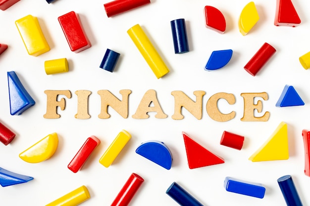 Free photo arrangement of colourful geometrical shapes and finance text