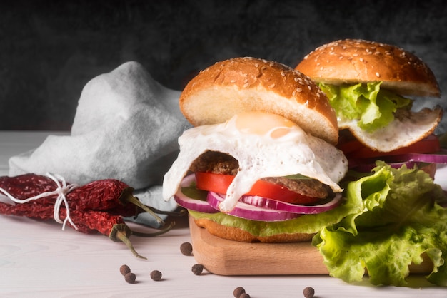 Free photo arrangement of delicious hamburgers with copy space