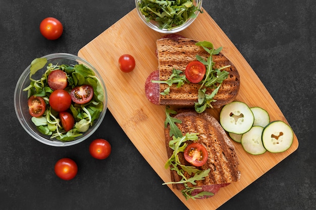 Free Photo arrangement of delicious sandwiches on wooden board