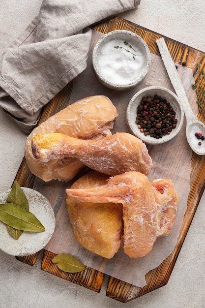 Arrangement of frozen chicken on the table