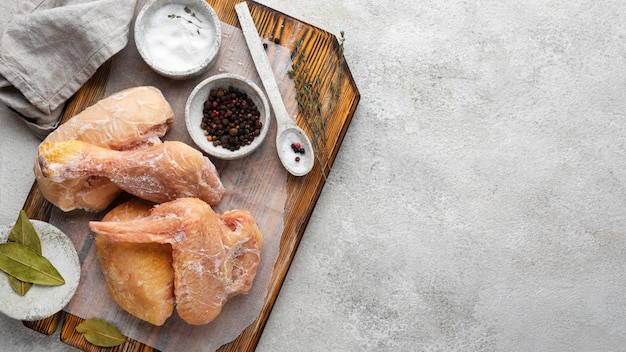 Arrangement of frozen chicken on the table