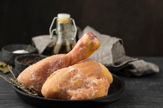 Free Photo arrangement of frozen chicken on the table