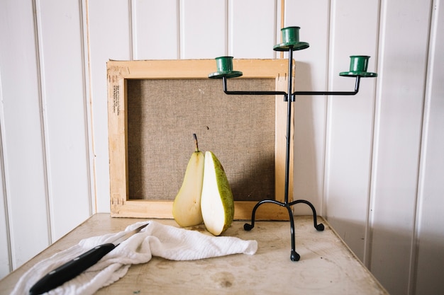 Free photo arrangement of fruit with candlestick