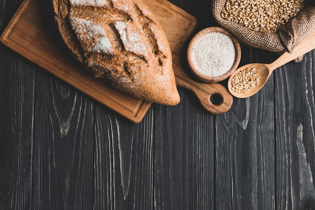 Free Photo arrangement of healthy loaf bun on board