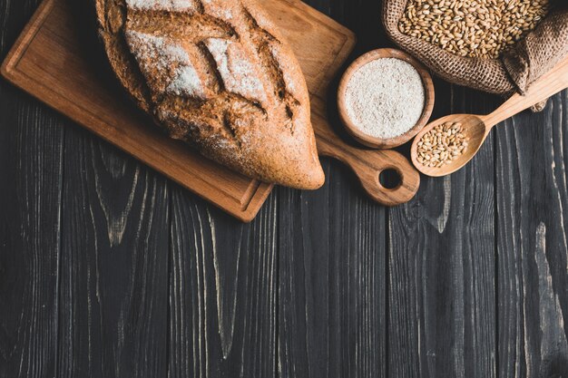 Arrangement of healthy loaf bun on board