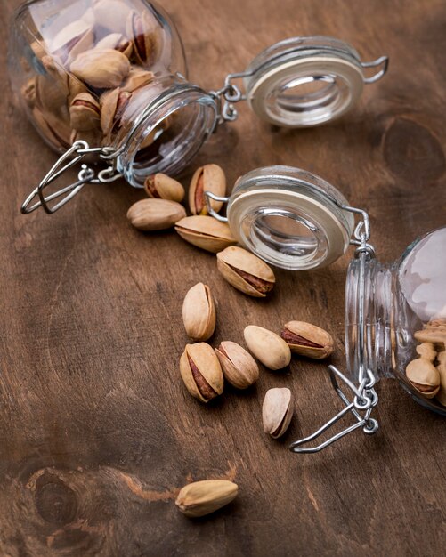 Arrangement of overturned jars filled with pistachos