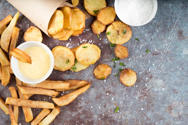 Free Photo arrangement of potato fries and potato chips with copy space