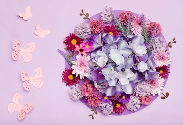 Free photo arrangement of pretty flowers with purple background