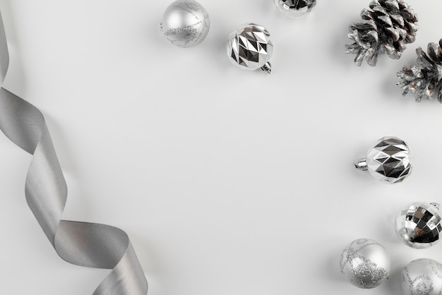 Free photo arrangement of silver ribbon and christmas balls