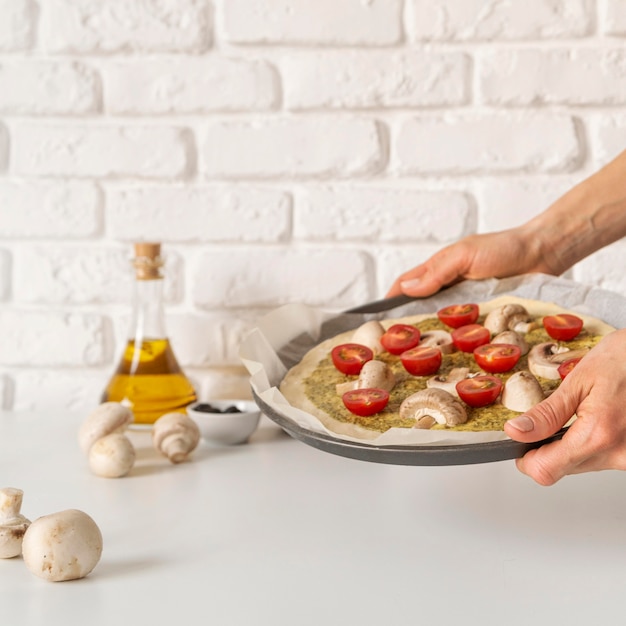 Free photo arrangement of tasty pizza in the making