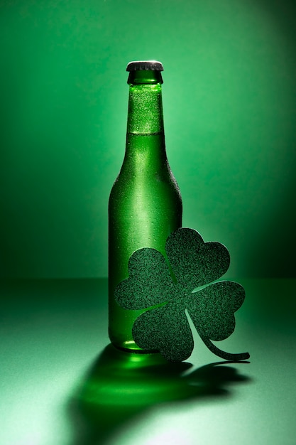 Free photo arrangement with beer bottle and clover