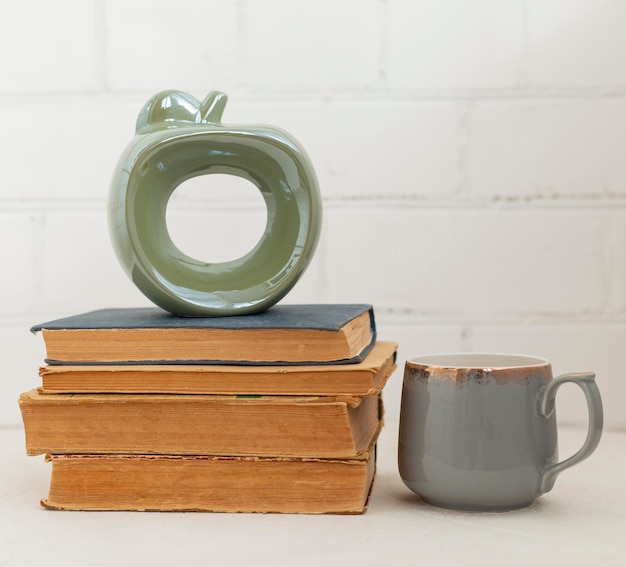 Arrangement with books and drink