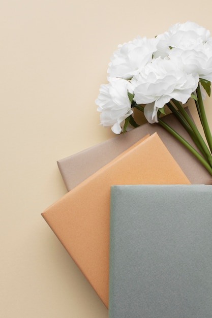 Arrangement with books and white flowers