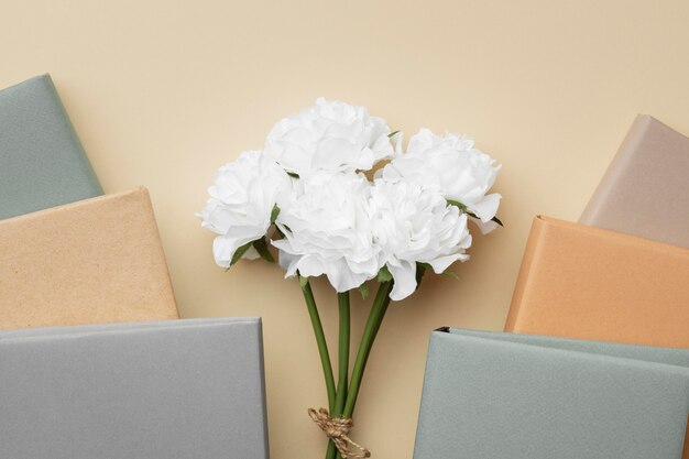 Arrangement with books and white flowers