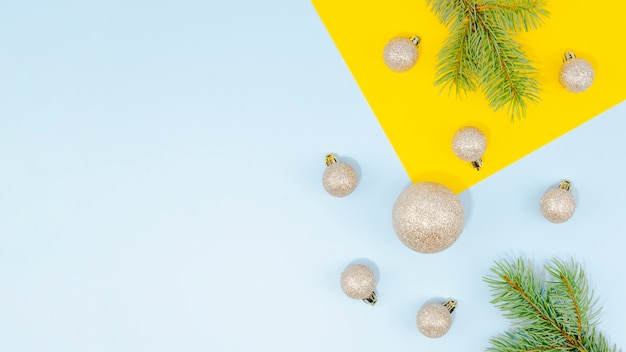 Free Photo arrangement with christmas balls and pine leaves and copy space