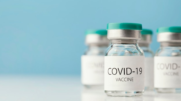 Arrangement with coronavirus vaccine bottle