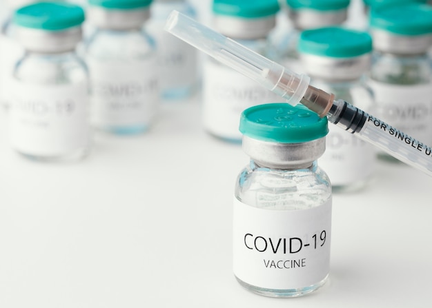 Free photo arrangement with coronavirus vaccine bottle