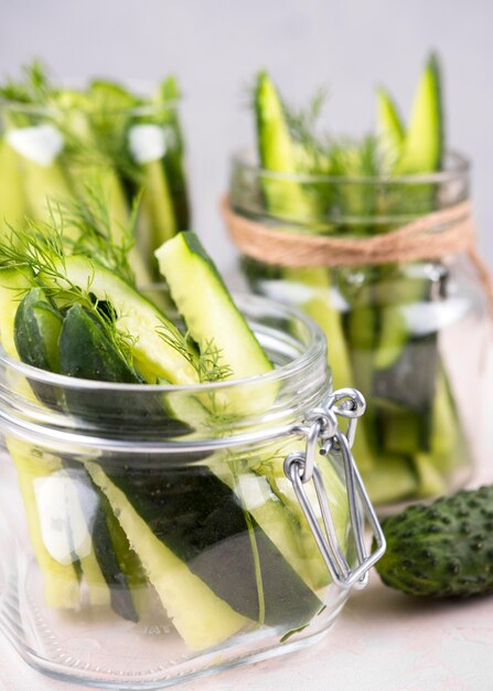 Arrangement with cucumbers in jars