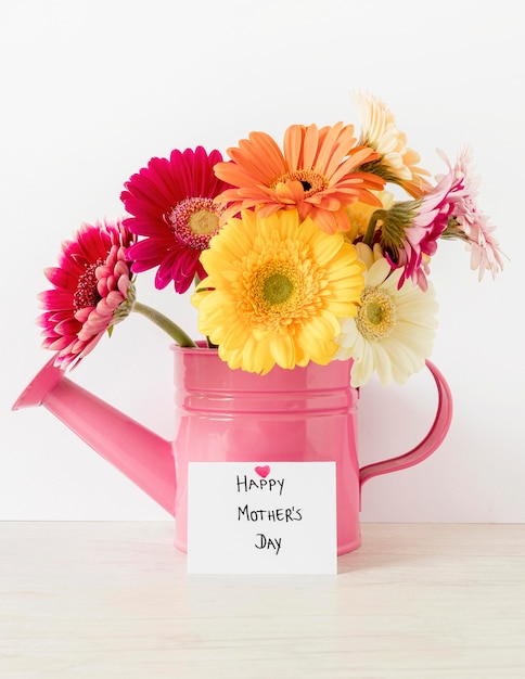 Free photo arrangement with flowers in watering can