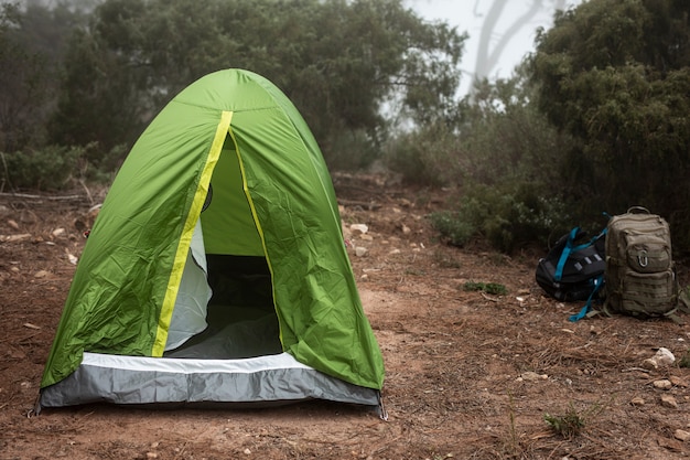 Arrangement with green tent in nature