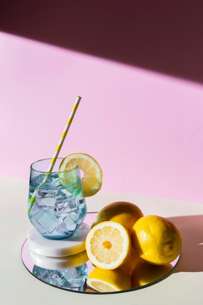 Free photo arrangement with lemons and drink