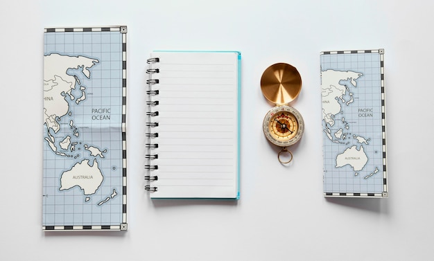 Free photo arrangement with maps and notebook